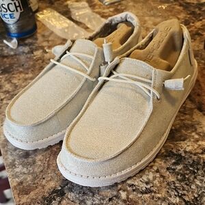 Hey Dude Women’s Glitter Slip-On Loafers in Light Silver